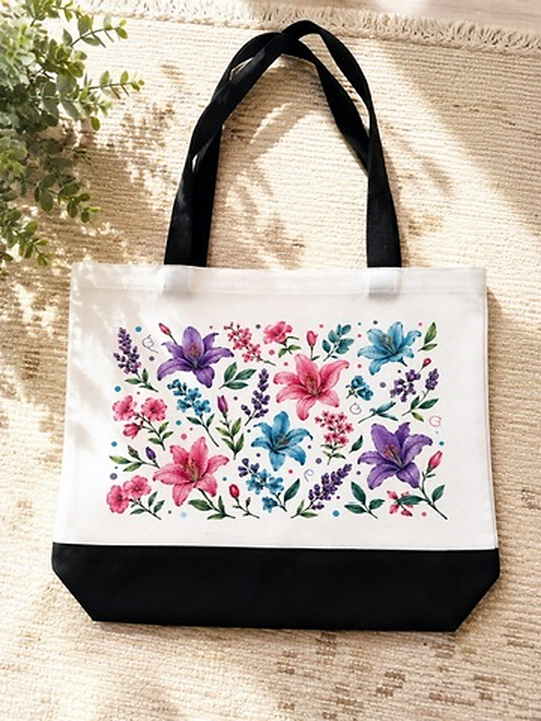 white tote with black handles and black bottom strip